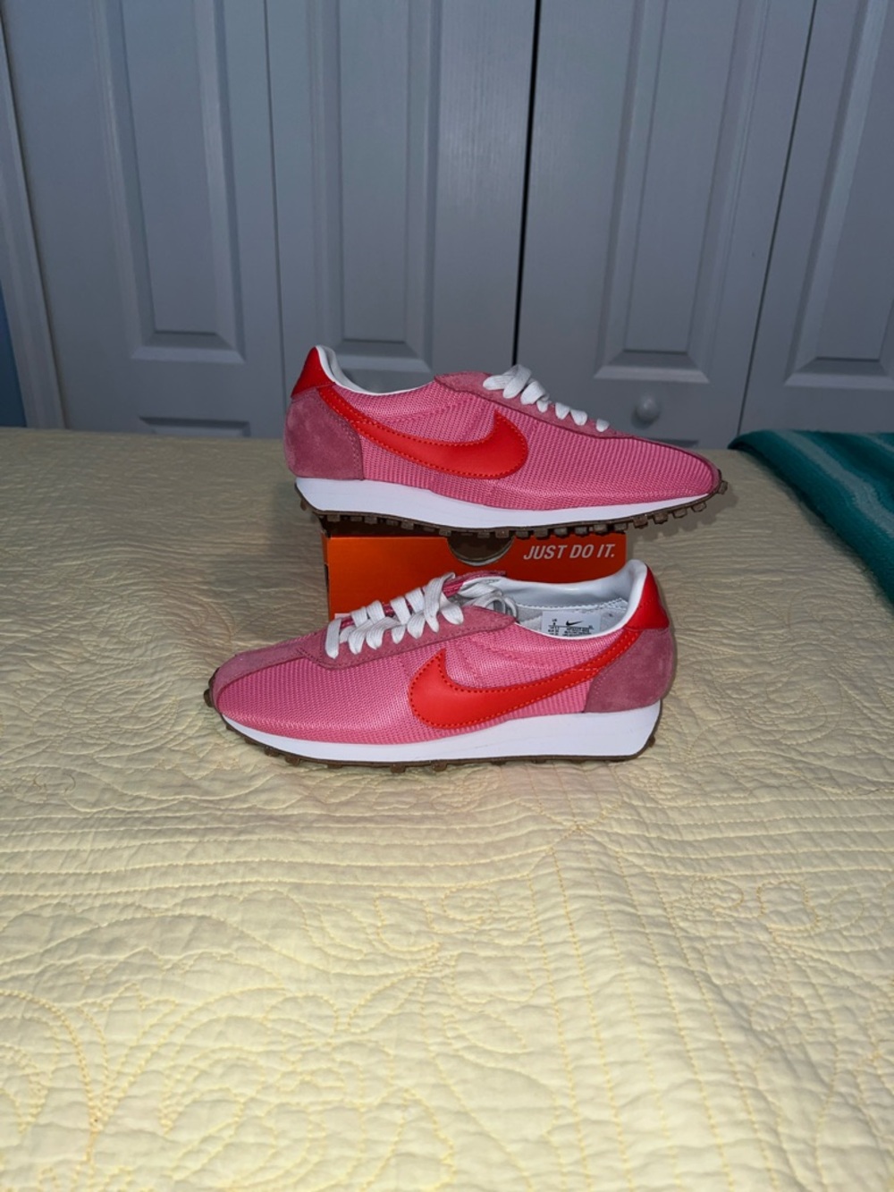 Nike Women's Pink Sneakers with Red Swoosh